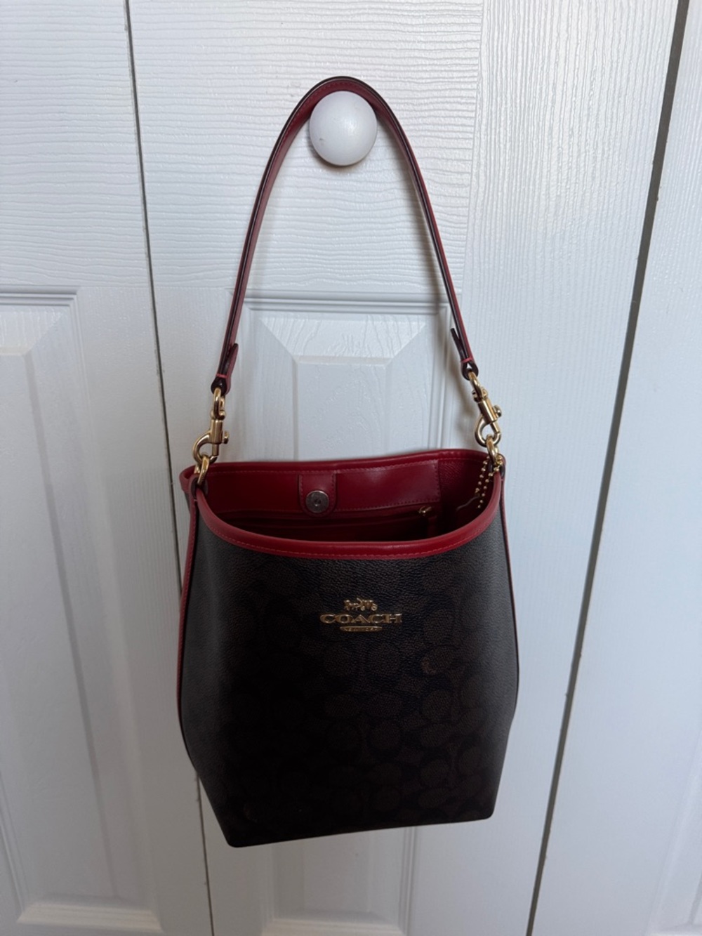 Coach Brown Signature Bucket Bag with Red Trim